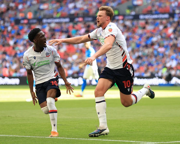 Bolton Secures Championship Return with Victory over Stockport